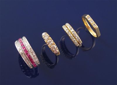 Appraisal: A diamond sapphire and ruby set double swivel eternity ring