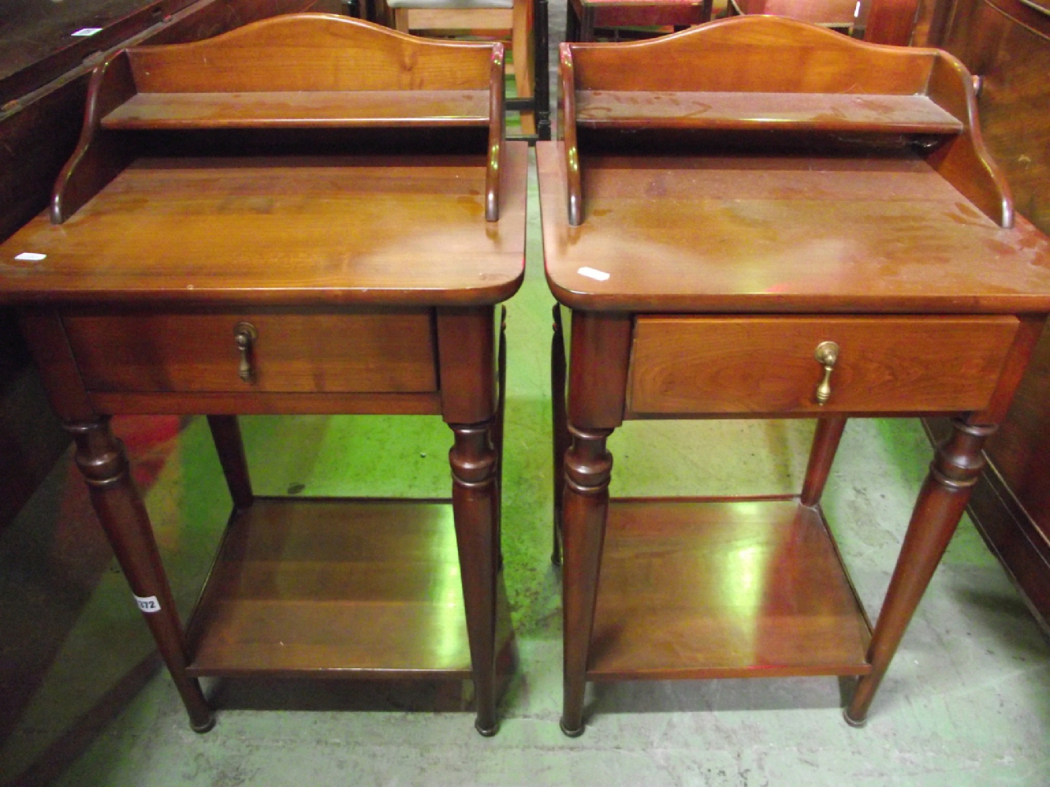 Appraisal: A pair of contemporary cherrywood bedside tables each fitted with