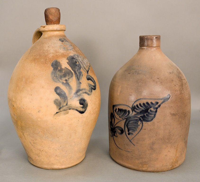 Appraisal: Two Stoneware jugs each with blue decoration and floral designs