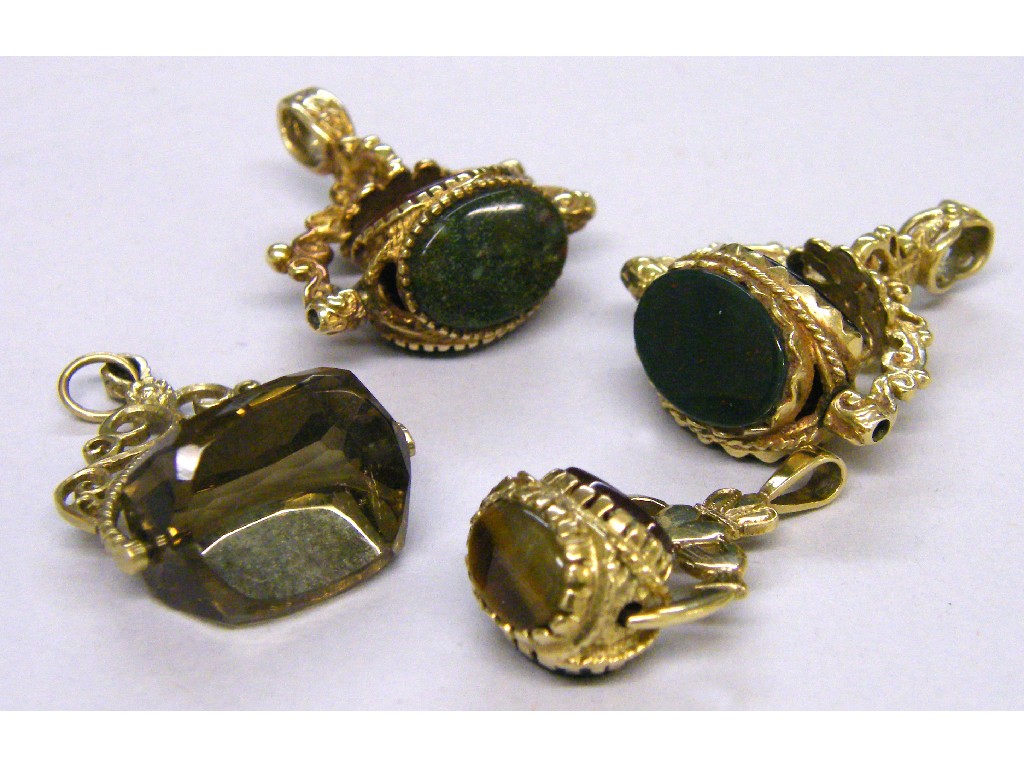 Appraisal: Four ct stone set swivel fob pendants