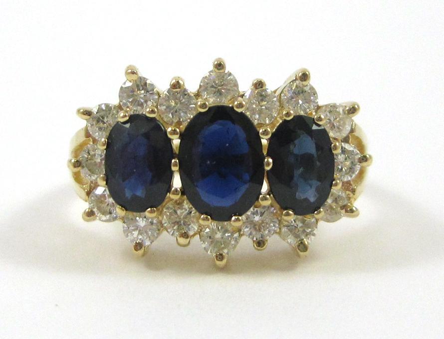 Appraisal: SAPPHIRE DIAMOND AND FOURTEEN KARAT GOLD RING with round-cut diamonds