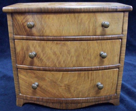 Appraisal: An apprentice's walnut chest fitted three long drawers cm wide