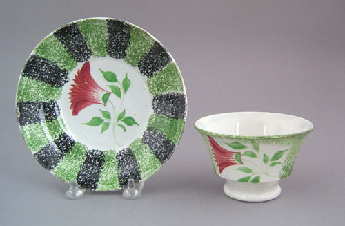 Appraisal: Green and black rainbow spatter cup and saucer th c