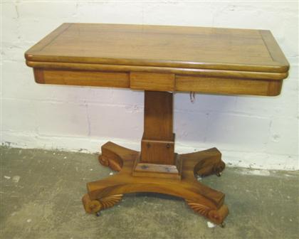 Appraisal: Empire style walnut games table The hinged rectangular top raised