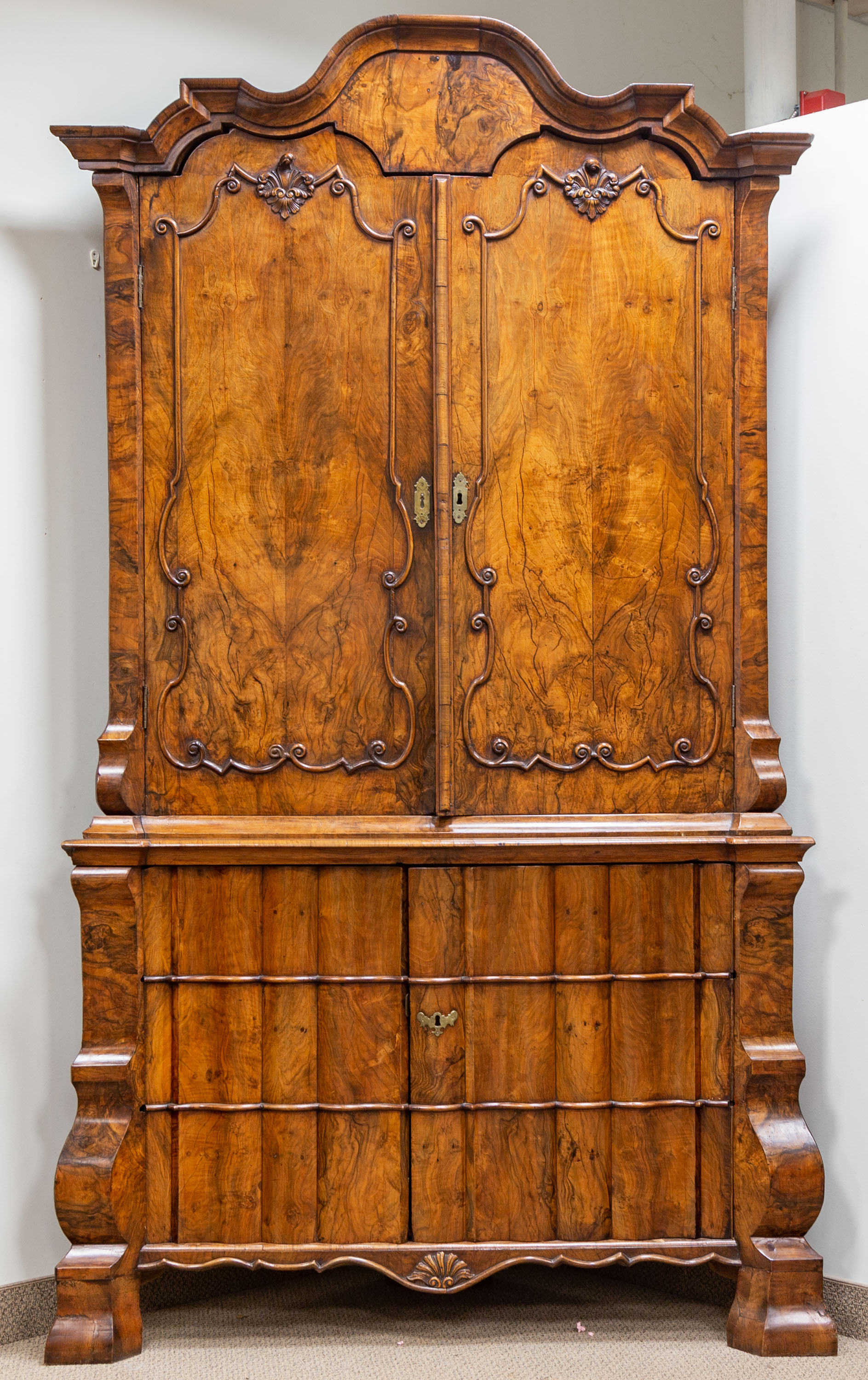 Appraisal: CONTINENTAL ENGLISH WALNUT CORNER CABINET th century carved fleur-de-lis and