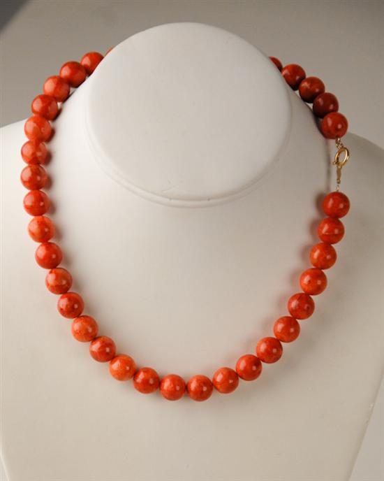 Appraisal: A Strand of Coral Beads Necklace with a gold filled