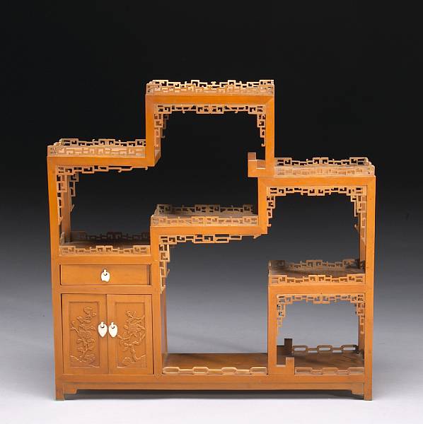 Appraisal: An elegant carved wood treasure cabinet Republic Period Composed of