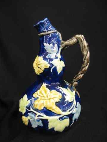 Appraisal: Majolica Pottery Jug flowering vine on cobalt gourd shape ''