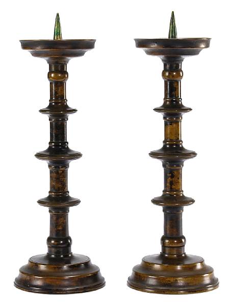 Appraisal: A pair of Baroque style patinated bronze pricket candlesticks th