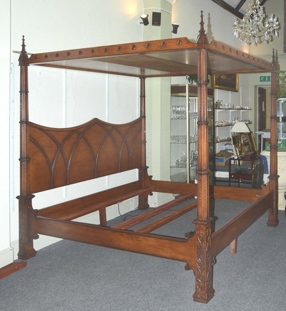 Appraisal: A GEORGIAN GOTHIC STYLE FOUR POSTER BED with carved pierced