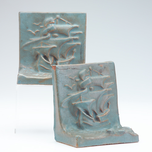 Appraisal: ARTS CRAFTS Pair of bookends embossed with tall ships on