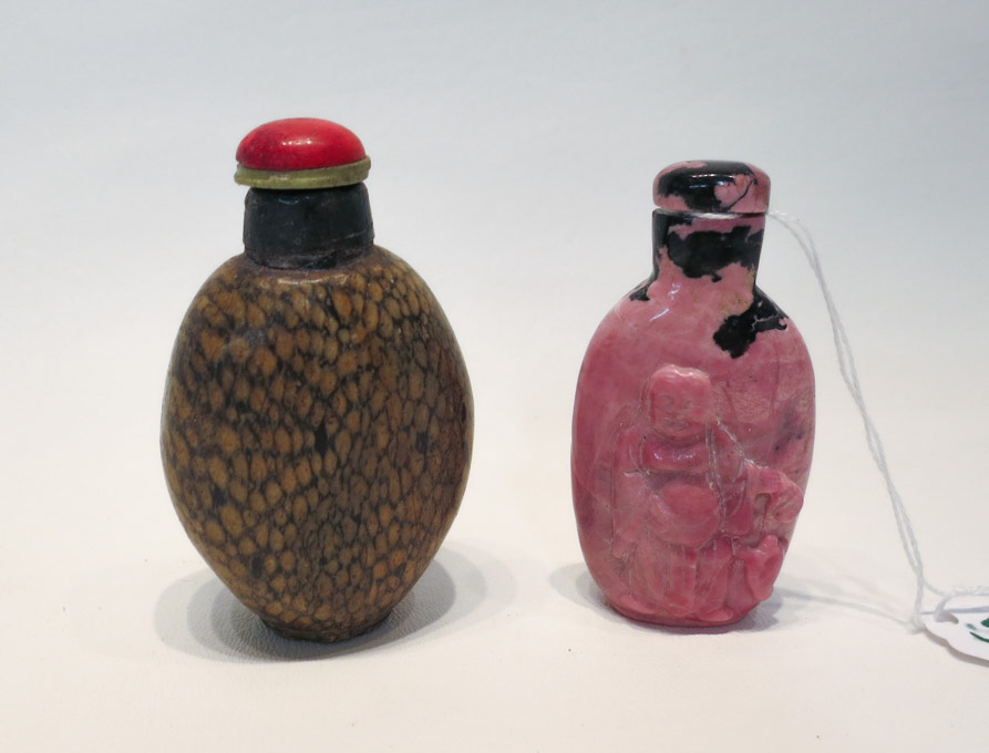 Appraisal: TWO CHINESE HARDSTONE SNUFF BOTTLES an oval flattened snuff bottle