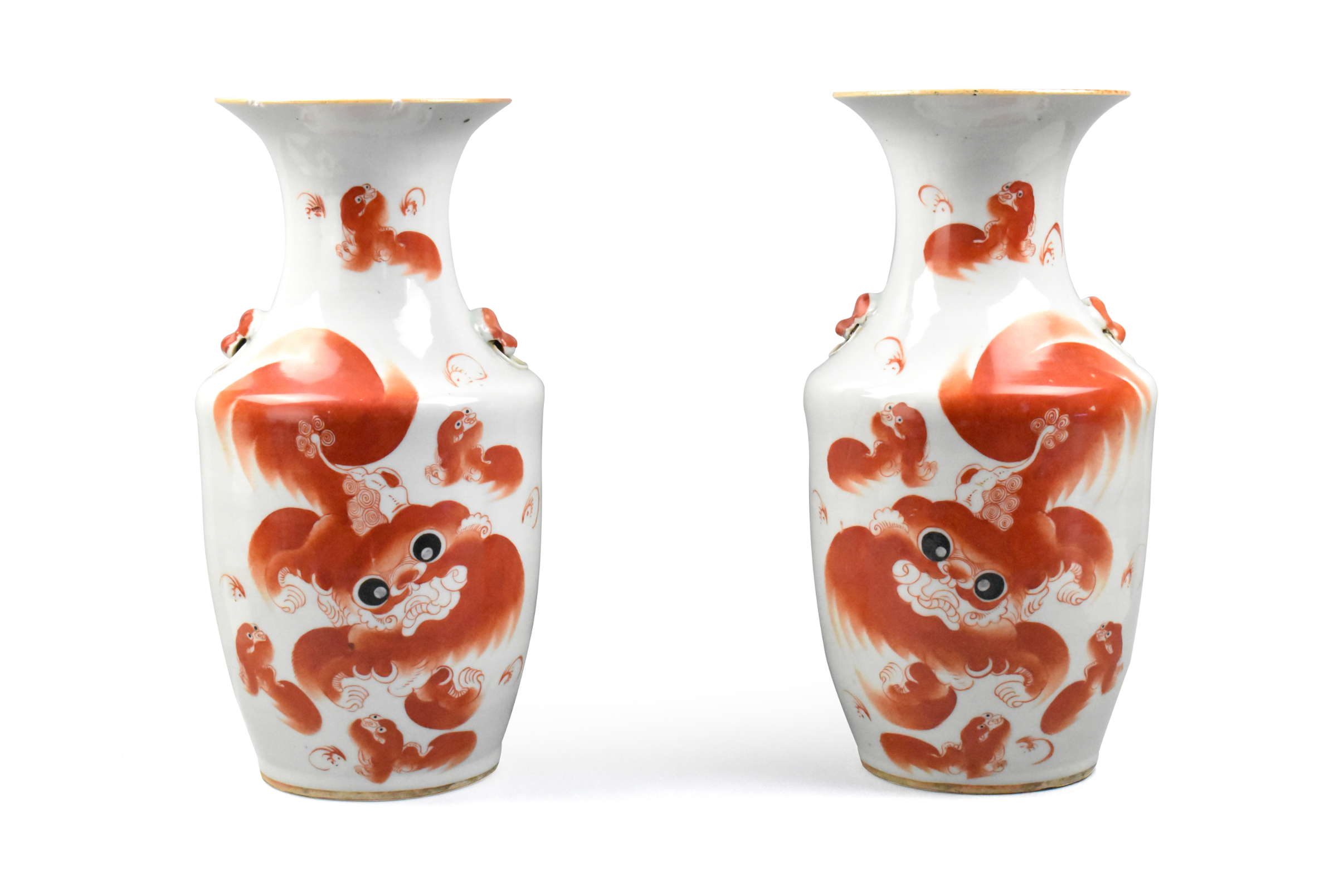 Appraisal: A pair of Chinese iron red foo lion vases dating