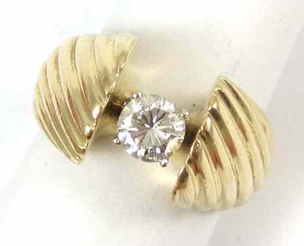 Appraisal: DIAMOND AND FOURTEEN KARAT GOLD SOLITAIRE RING set with a