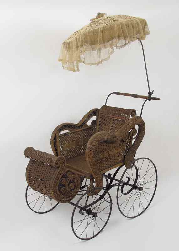 Appraisal: VICTORIAN WICKER PRAM BABY CARRIAGE Brown wicker with iron hardware