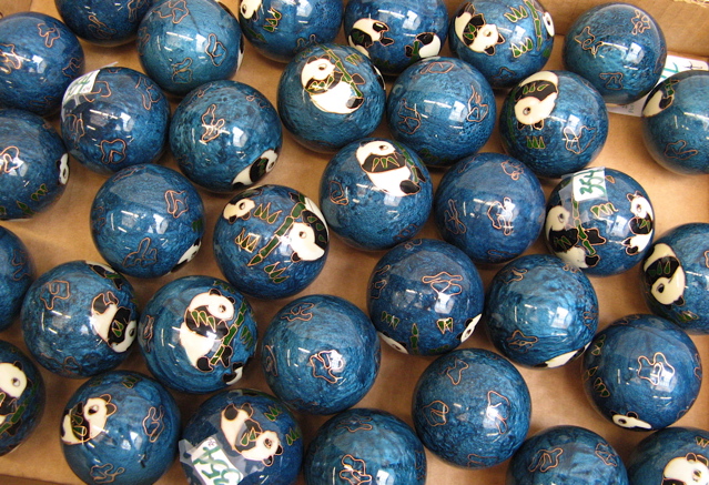 Appraisal: THIRTY-FOUR CHINESE BAODING EXERCISE BALLS exterior having panda decorations on