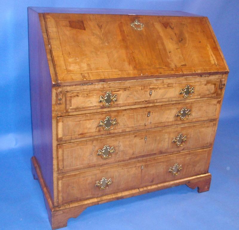 Appraisal: A George I walnut bureau with fall flap revealing a