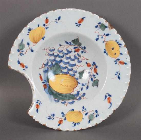 Appraisal: English polychrome Delftware barber's bowl circa molded scalloped border grapefruit