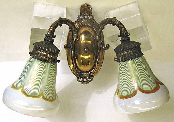 Appraisal: An American gilt metal two light sconce with two art