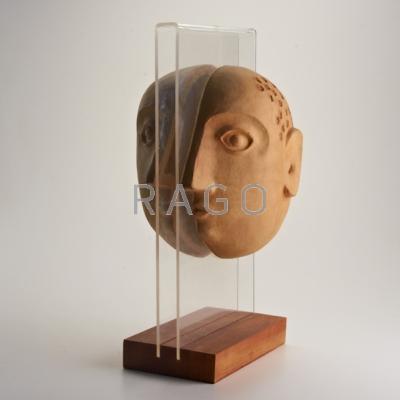 Appraisal: DAVID GIL BENNINGTON POTTERS Stoneware face sculpture on acrylic and