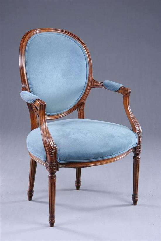 Appraisal: PROVINCIAL LOUIS XVI STYLE FAUTEUIL th century fruitwood Molded medallion