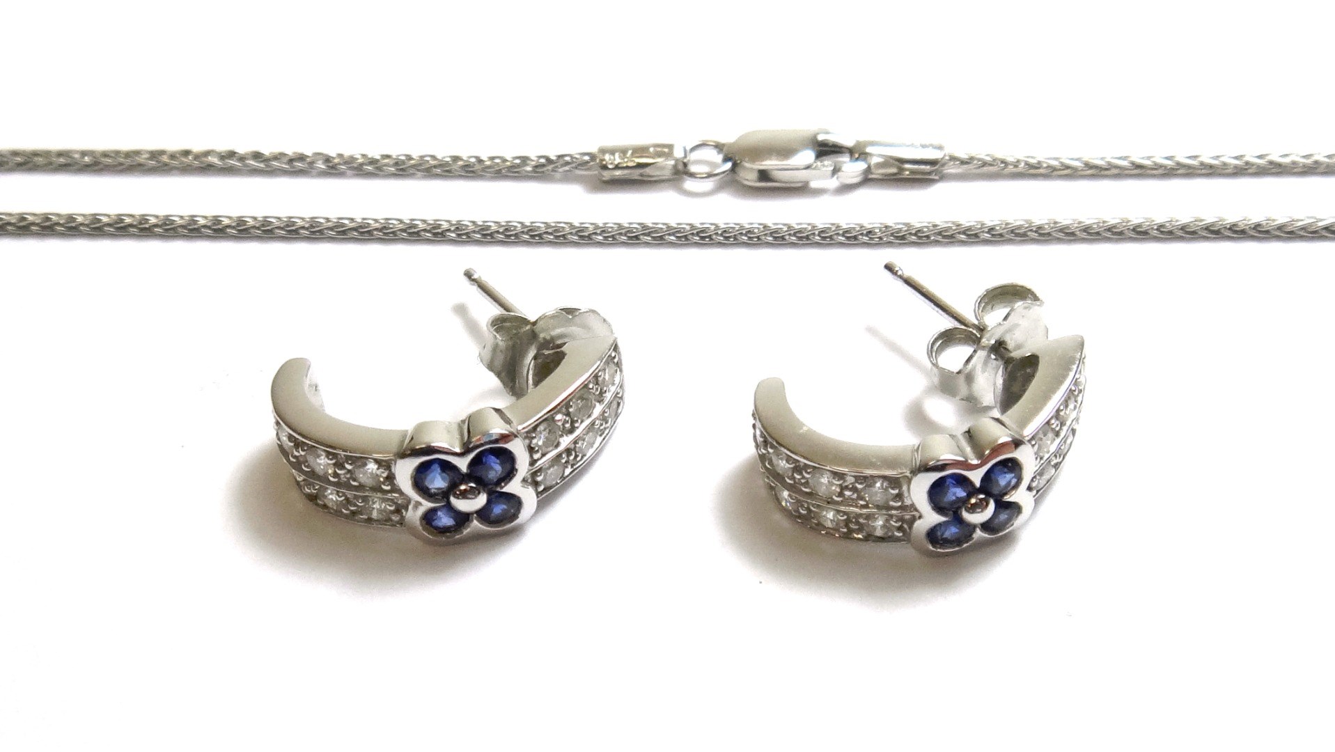 Appraisal: A pair of sapphire and diamond set earstuds each in