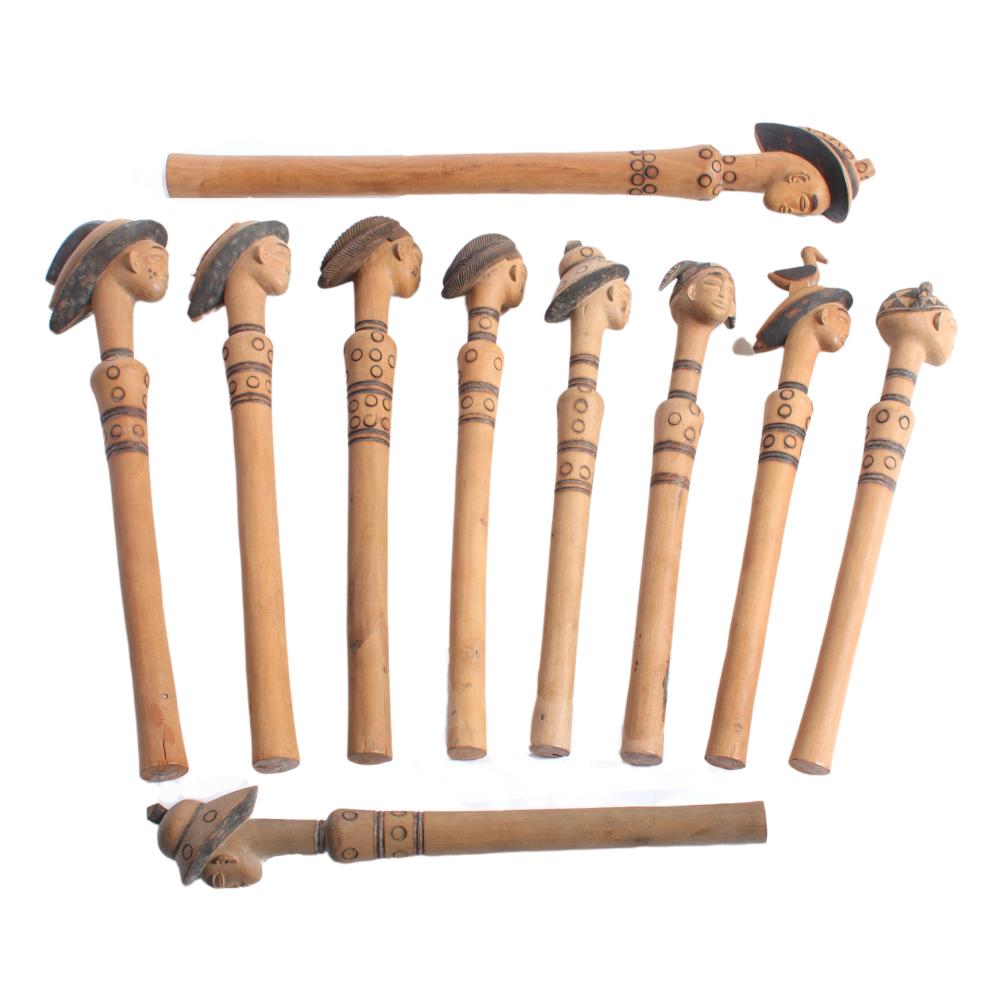 Appraisal: TEN AFRICAN CEREMONIAL FIGURAL SCEPTER MALLETS WITH CARVED STAINED WOOD