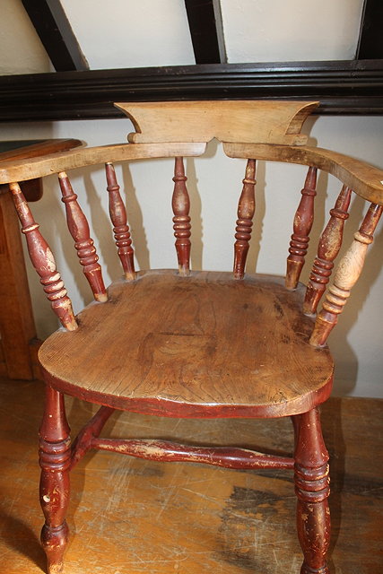 Appraisal: AN ASH AND ELM CAPTAIN'S CHAIR with turned spindle back