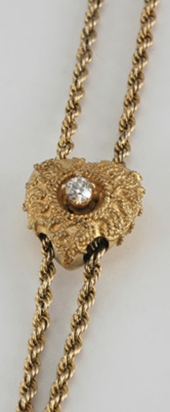 Appraisal: A gold guard chain The fine rope twist chain in