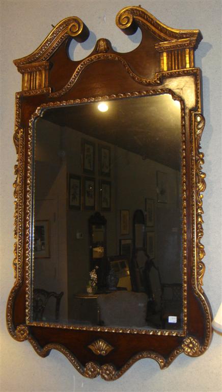 Appraisal: CHIPPENDALE GOLD AND MAHOGANY CARVED TRIM MIRROR h w in