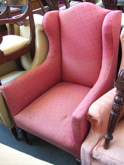 Appraisal: A th century mahogany framed wing armchair upholstered in pink