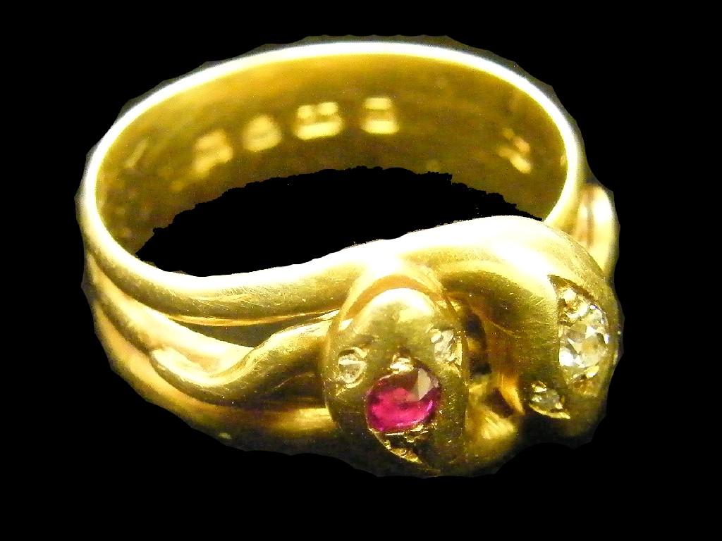 Appraisal: ct snake design band ring set with a ruby and