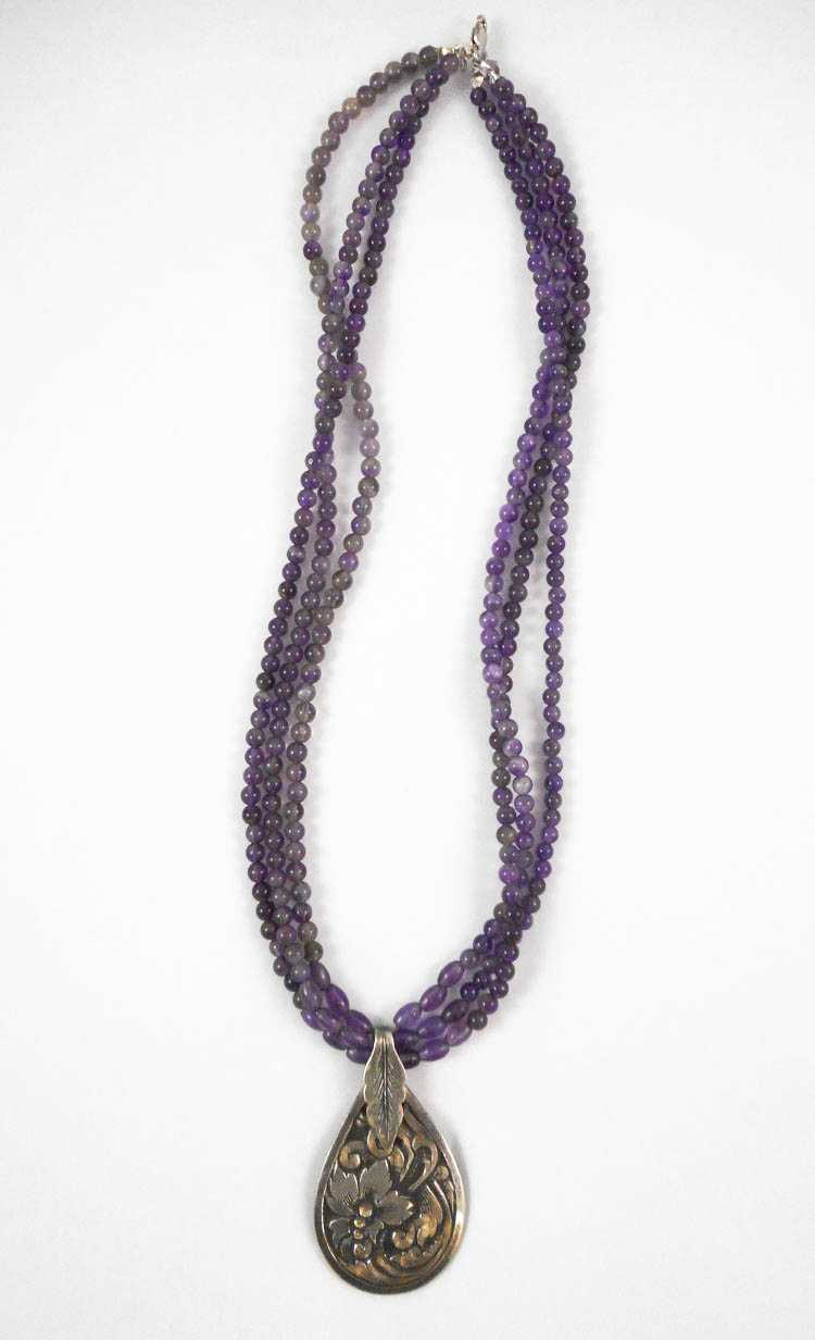 Appraisal: MULTI-STRAND AMETHYST NECKLACE measuring - inches in length with three