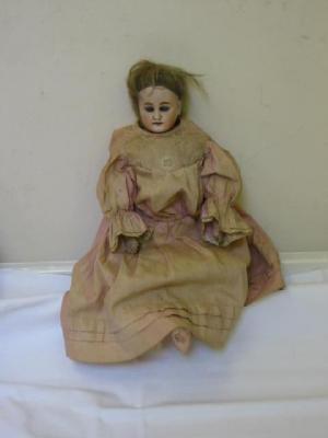 Appraisal: A German bisque shoulder head doll with blue glass sleeping