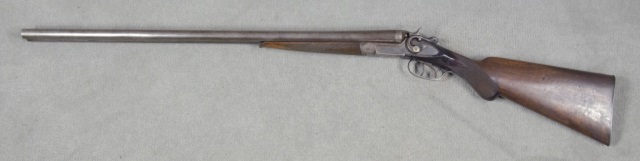 Appraisal: Belgium-Made Damascus Side-by-Side ShotgunIn GA Serial All brown grey gun