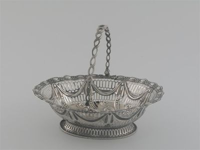 Appraisal: A Victorian oval sweetmeat basket with fret work body embossed