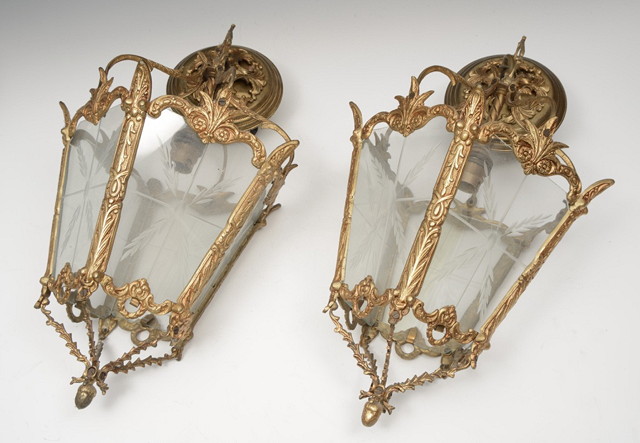 Appraisal: A PAIR OF GILT METAL FOUR SIDED HANGING LANTERNS with