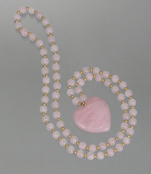 Appraisal: A Rose Quartz Bead Necklace with a Carved Heart Shape