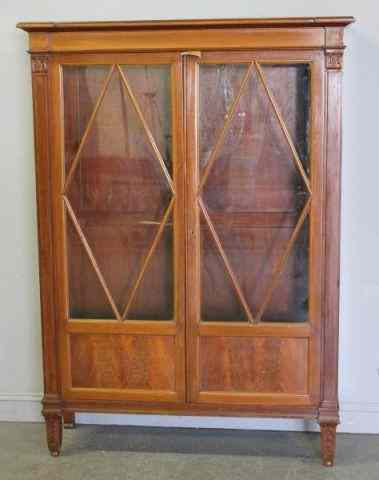 Appraisal: Continental Mahogany Neoclassical Style Two DoorCabinet Stylized carved feet and