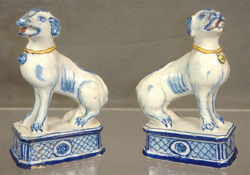 Appraisal: Pr th c Delft dog figures fritting to edges one