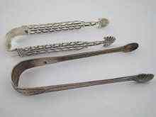 Appraisal: Two pairs of Georgian silver tongs being one pair cast