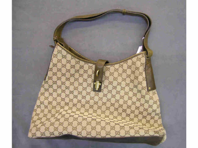 Appraisal: Gucci handbag brown logo fabric with brown leather trim and