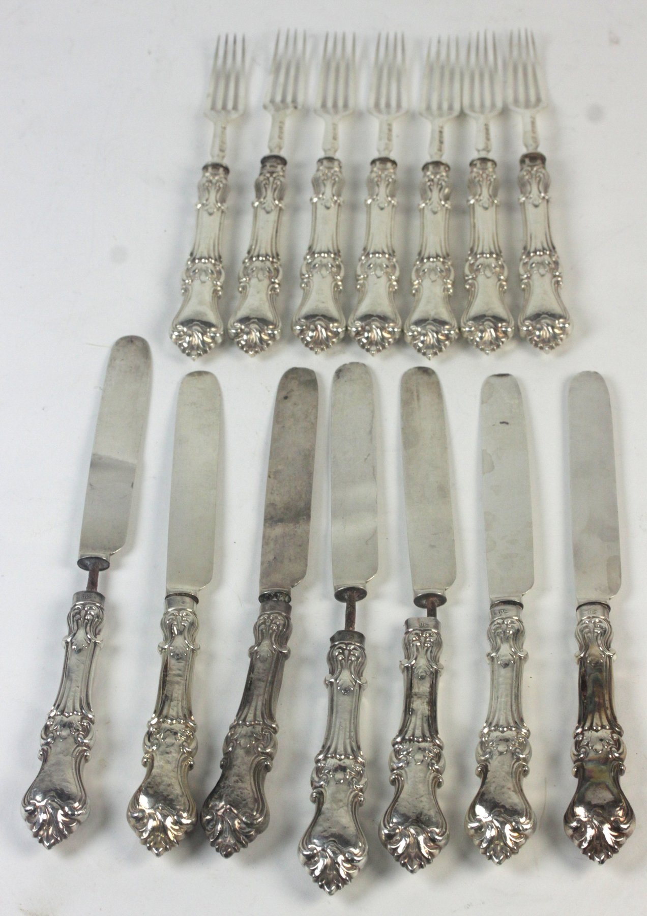 Appraisal: A set of seven pairs of silver dessert knives and