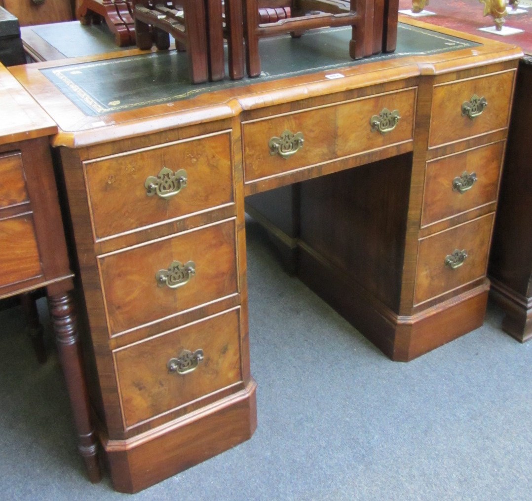 Appraisal: A th century walnut inverted breakfront kneehole writing desk with