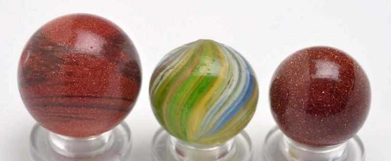 Appraisal: Lot of Lutz Goldstone Marbles Description Includes two early Goldstone