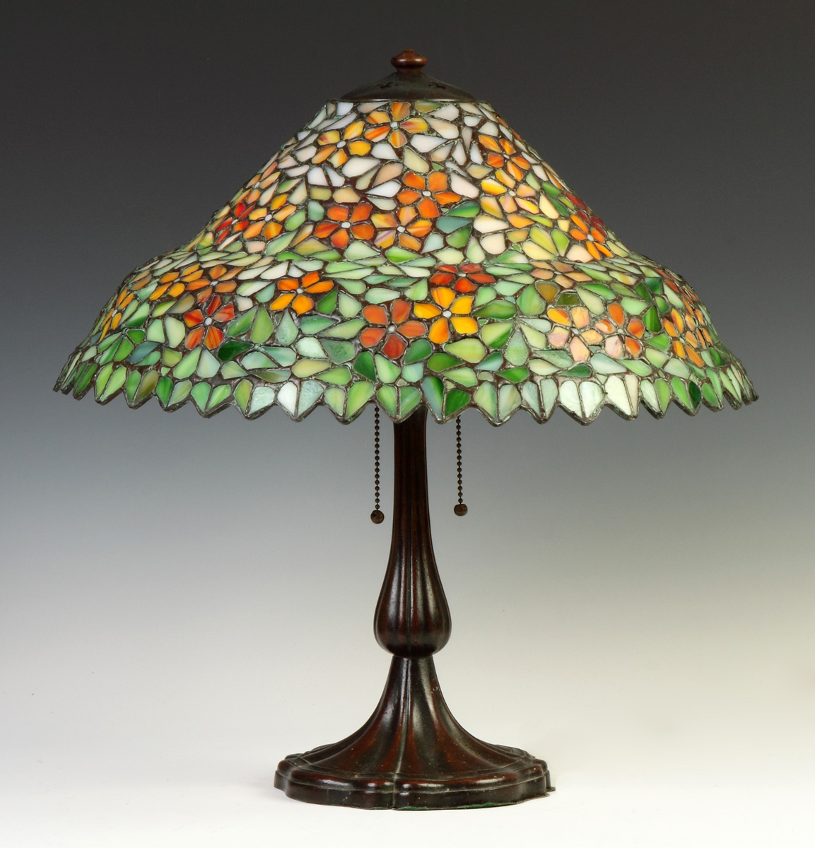 Appraisal: Leaded Glass Floral Lamp Early th cent Patinaed metal base