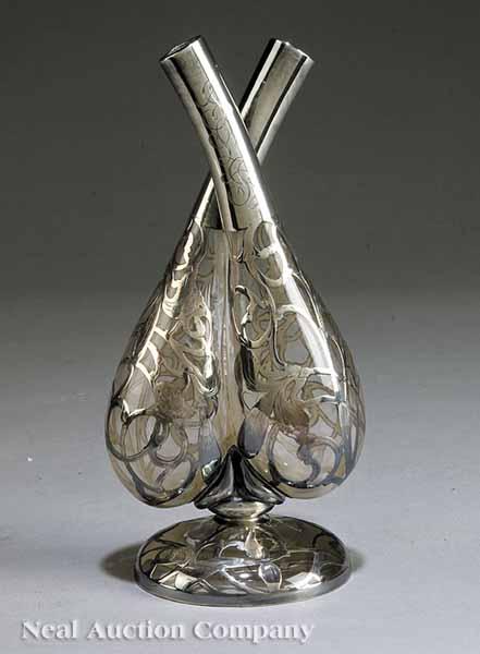 Appraisal: A Silver Overlay Double Cruet with scrollwork overlay of silverplate