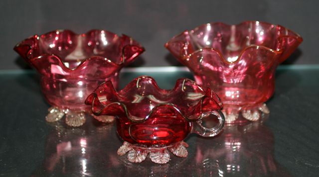 Appraisal: Pair of Victorian cranberry glass frilled bowls and another smaller