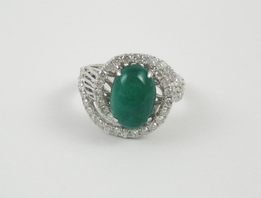 Appraisal: JADE DIAMOND AND FOURTEEN KARAT GOLD RING The white gold