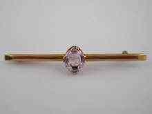 Appraisal: A ct gold bar brooch with central oval pink topaz